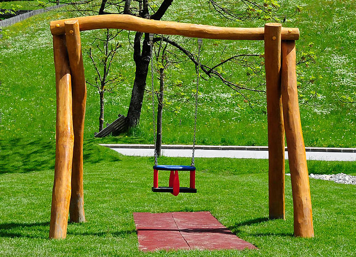 Swing with toddler seat for public palygrounds