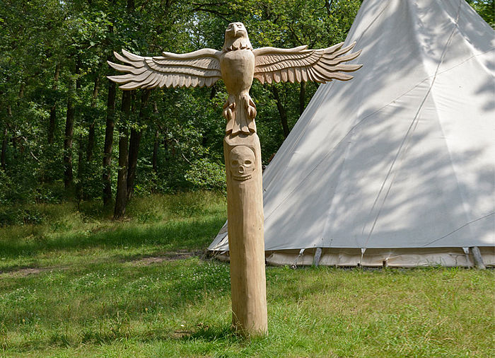 Totem pole made of Robinia wood
