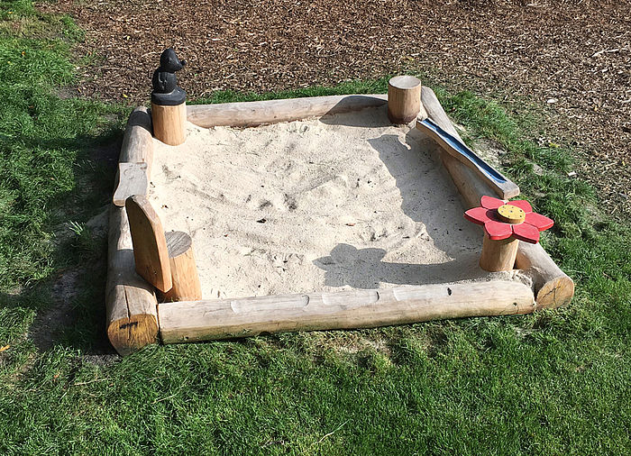 Sandpit with many  playing elements made of Robinia wood