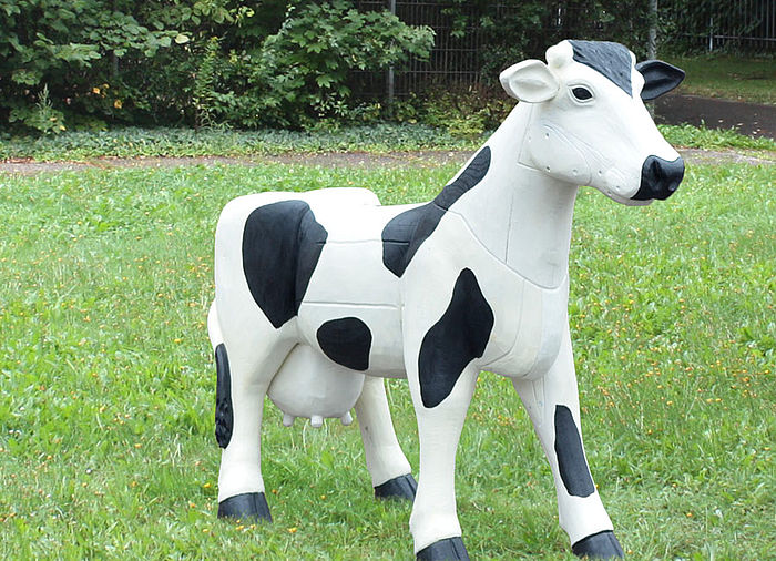 Carved figure cow made of Robinia wood