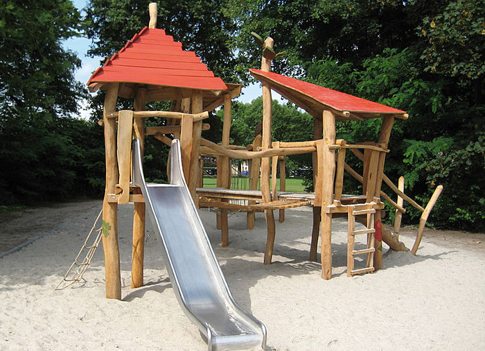 Playtower with connected elements and slide
