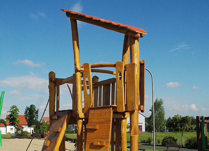 Play tower made of wood with 2 climbing walls