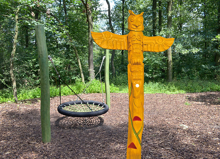 Totem pole made of wood - owl
