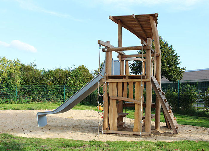Slide tower with climbing wall